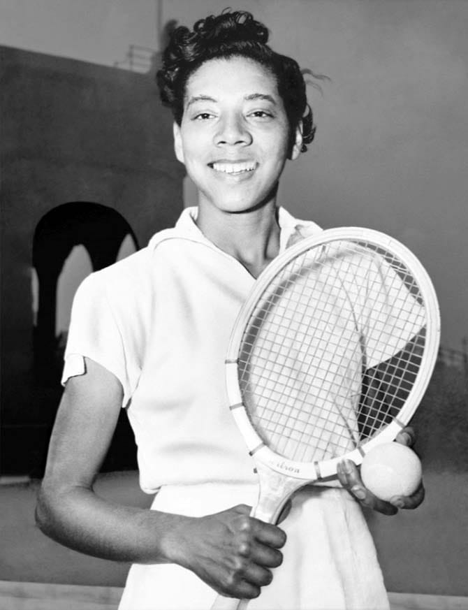 Althea Gibson with a wooden racquet and a tennis ball circa 1950. Courtesy of the Library of Congress.
