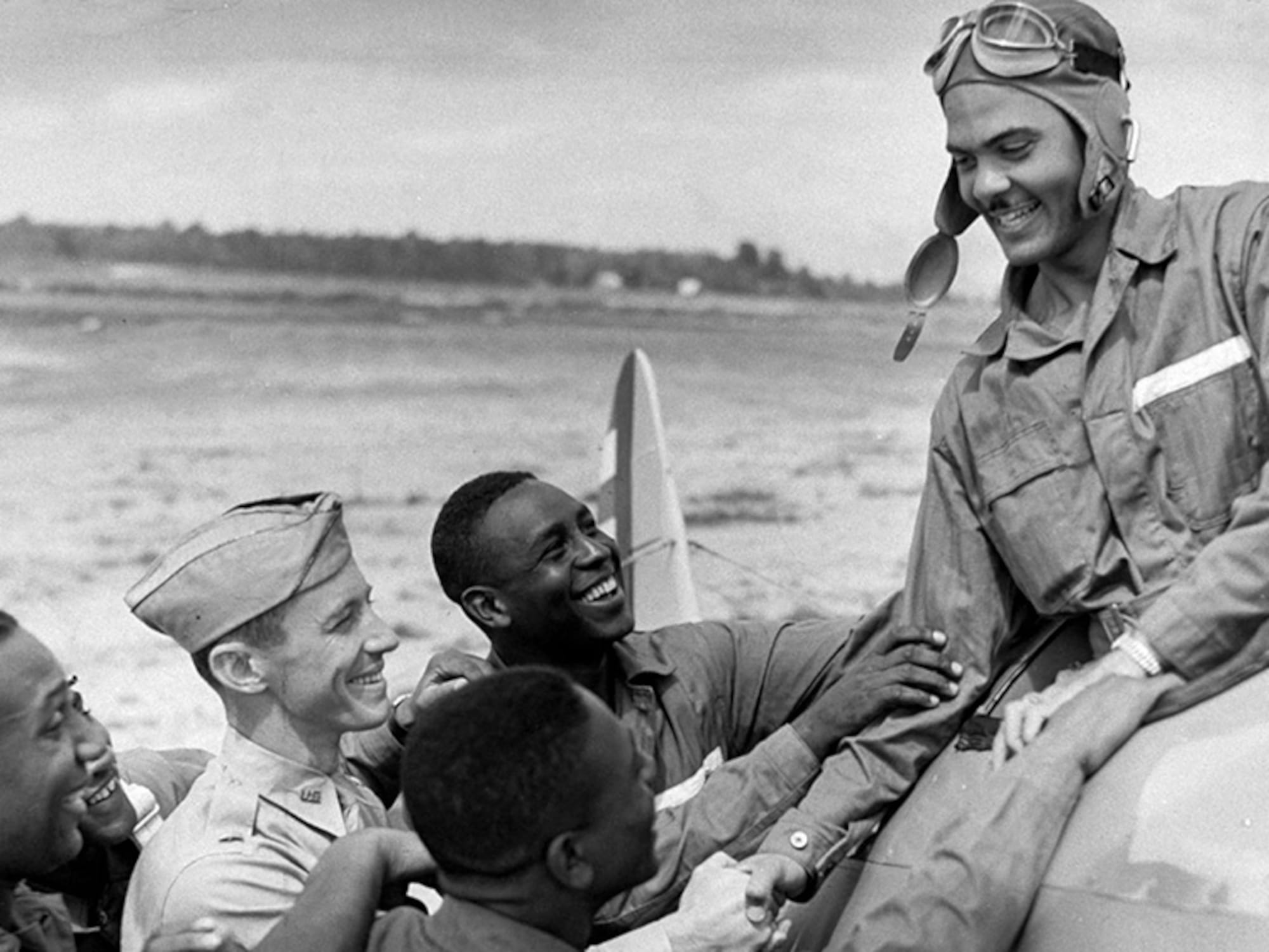 Benjamin O. Davis, Jr., is greeted by other cadets at the Tuskegee Army Air Field in Alabama.