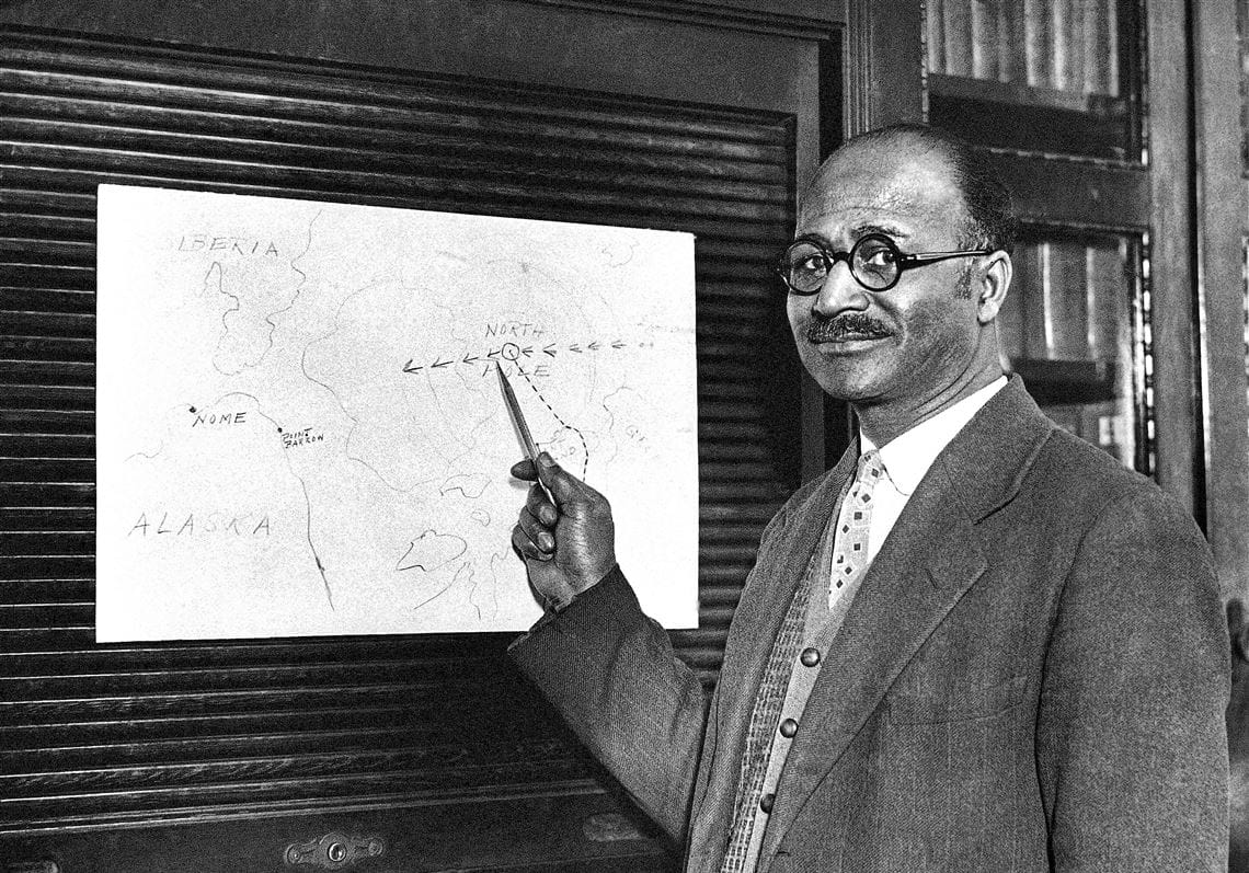 Matthew Henson points to a map which follows the flights of Byrd and the Amundsen-Ellsworth expeditions to North Pole in 1926.