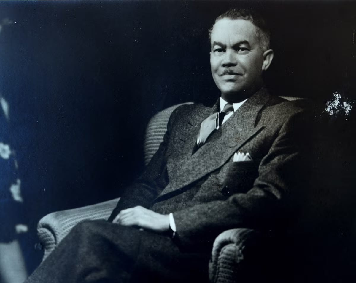 Paul R. Williams sitting in a chair. Mel Melcon and Getty Images.