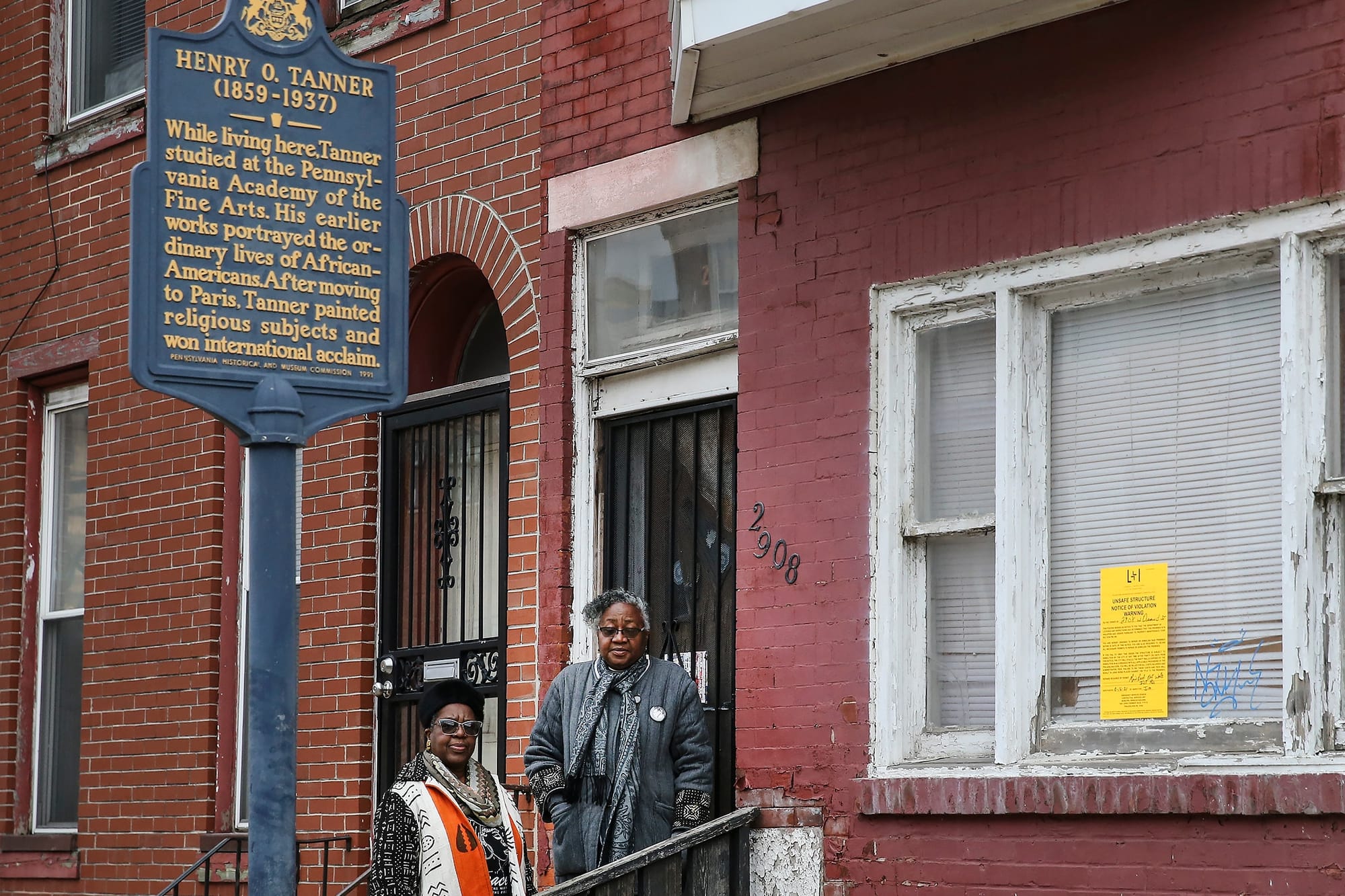 Deborah Gary and Jacqueline Wiggins stand outside of the Tanner House on the 2900 block of Diamond Street in Philadelphia.