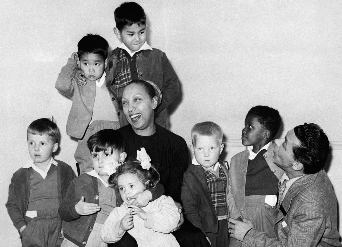Josephine Baker and her husband, Joe Bouillon, pose with seven of their children. 
