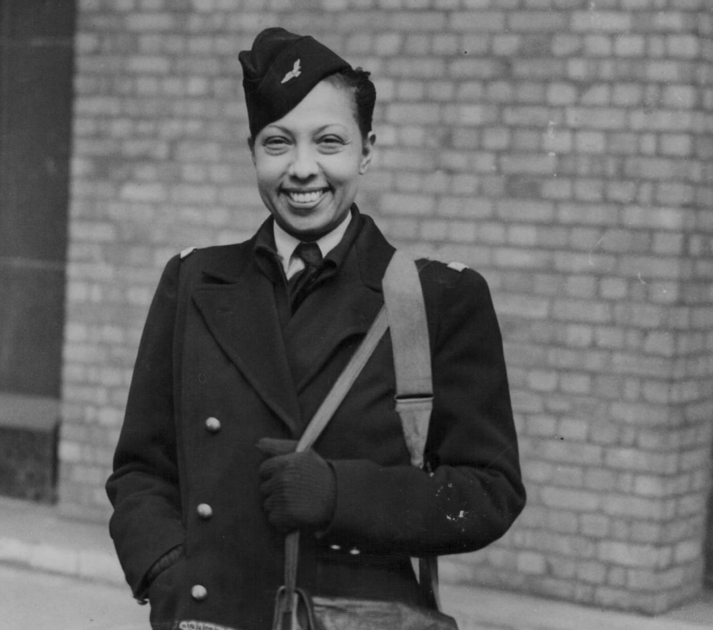 a black and white photo of josephine baker in her french military uniform