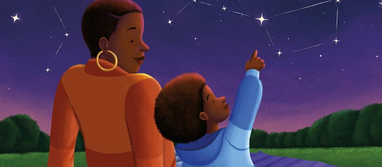 A little black boy with an afro points at the big dipper as he sits next to his mom.