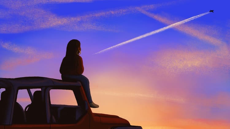Alleanna sits on a red Jeep wrangler and watches a plane fly across the sunset sky.